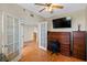 Office or bedroom with hardwood floors, mirrored closet doors, and French doors at 7892 Sailboat Key S Blvd # 408, South Pasadena, FL 33707