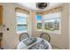 Cozy breakfast nook with waterfront views through large windows with decorative valances at 7892 Sailboat Key S Blvd # 408, South Pasadena, FL 33707