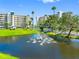 The property features a lovely pond with a fountain and manicured landscaping at 7892 Sailboat Key S Blvd # 408, South Pasadena, FL 33707