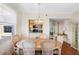 Cozy dining area featuring seating for six with a view of the adjacent kitchen at 7892 Sailboat Key S Blvd # 408, South Pasadena, FL 33707