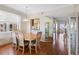 Elegant dining room with seating for six, a chandelier, and natural light at 7892 Sailboat Key S Blvd # 408, South Pasadena, FL 33707