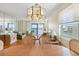 Comfortable dining room offering both a chandelier and waterfront view at 7892 Sailboat Key S Blvd # 408, South Pasadena, FL 33707