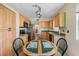 Well-lit kitchen features oak cabinets, modern appliances, and adjacent breakfast nook at 7892 Sailboat Key S Blvd # 408, South Pasadena, FL 33707