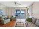 Cozy living room with wood floors, waterfront view, and neutral paint at 7892 Sailboat Key S Blvd # 408, South Pasadena, FL 33707