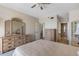 Spacious main bedroom features a dresser with tri-fold mirror and en suite bathroom at 7892 Sailboat Key S Blvd # 408, South Pasadena, FL 33707