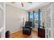 Sunlit home office features hardwood floors, city views, and comfortable seating area at 7892 Sailboat Key S Blvd # 408, South Pasadena, FL 33707