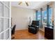 Comfortable home office boasts natural light, wood floors, and a relaxing recliner at 7892 Sailboat Key S Blvd # 408, South Pasadena, FL 33707