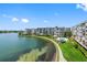 Wonderful waterfront view showcasing the grounds and pool of the community at 7892 Sailboat Key S Blvd # 408, South Pasadena, FL 33707