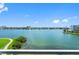 Expansive waterfront view of a body of water surrounded by residences and blue sky at 7892 Sailboat Key S Blvd # 408, South Pasadena, FL 33707