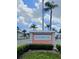 Community sign with 'Bardmoor' surrounded by well-maintained landscaping and palm trees under a clear sky at 8300 Bardmoor Blvd # 110, Seminole, FL 33777