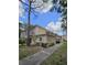 Inviting view of a two-story condo building with well-maintained landscaping and sidewalks at 8300 Bardmoor Blvd # 110, Seminole, FL 33777