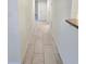 Hallway featuring tile flooring, leading to other areas of the home at 8300 Bardmoor Blvd # 110, Seminole, FL 33777
