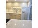 Close-up of kitchen featuring stone backsplash, updated appliances, and plenty of counterspace at 8300 Bardmoor Blvd # 110, Seminole, FL 33777