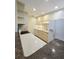 Well-lit kitchen with modern appliances, cream colored cabinetry, and contrasting countertops at 8300 Bardmoor Blvd # 110, Seminole, FL 33777