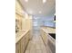 Spacious kitchen leading to living area, featuring a double sink and up-to-date appliances at 8300 Bardmoor Blvd # 110, Seminole, FL 33777