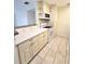 Kitchen with tiled floors, recessed lighting, and ample storage space with updated cabinetry at 8300 Bardmoor Blvd # 110, Seminole, FL 33777