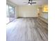 Bright living room featuring sliding glass doors leading to outdoor patio at 8300 Bardmoor Blvd # 110, Seminole, FL 33777