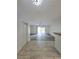 Bright living space with ceiling fan, sliding glass doors, and stylish flooring at 8300 Bardmoor Blvd # 110, Seminole, FL 33777