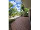Tiled patio surrounded by lush landscaping, offering a private and serene outdoor space at 8300 Bardmoor Blvd # 110, Seminole, FL 33777