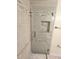 Beautiful glass-enclosed shower featuring neutral tile work and built-in niche at 8300 Bardmoor Blvd # 110, Seminole, FL 33777