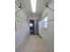 Walk-in closet with tile flooring, shelves, and hanging racks at 8300 Bardmoor Blvd # 110, Seminole, FL 33777