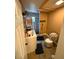Standard bathroom with a tiled shower, wood-look floor, and a white sink vanity at 8606 N 9Th St, Tampa, FL 33604