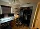 A cluttered room with shelving, a desk, and a closet, showcasing potential storage and workspace at 8606 N 9Th St, Tampa, FL 33604