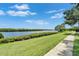 Scenic view of the waterway and lush green lawn that runs along the backyard of the home at 916 48Th Street E Dr, Bradenton, FL 34208