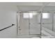 Bathroom featuring tub with sliding glass doors, a shower head, and soap dish at 916 48Th Street E Dr, Bradenton, FL 34208