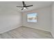 Bright bedroom featuring wood-look floors, neutral walls and a window with a view at 916 48Th Street E Dr, Bradenton, FL 34208