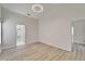 Bright bedroom featuring wood-look floors and an elegant, modern light fixture at 916 48Th Street E Dr, Bradenton, FL 34208