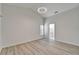 Bright room with modern flooring and doorway leading to an ensuite bathroom at 916 48Th Street E Dr, Bradenton, FL 34208