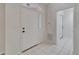 Bright foyer with white tile and a view into the house at 916 48Th Street E Dr, Bradenton, FL 34208