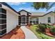 Inviting front walkway leading to the detailed front entrance and landscaped yard at 916 48Th Street E Dr, Bradenton, FL 34208