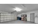 Spacious two car garage with storage shelving and a water heater at 916 48Th Street E Dr, Bradenton, FL 34208