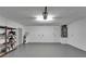 Clean, spacious garage with overhead lighting, water heater, and plenty of room for storage at 916 48Th Street E Dr, Bradenton, FL 34208