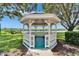 Scenic white gazebo with a waterfront view, nestled in a beautifully landscaped community at 916 48Th Street E Dr, Bradenton, FL 34208