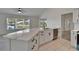 Bright kitchen featuring a stunning quartz-topped island, stainless steel appliances, and modern white cabinetry at 916 48Th Street E Dr, Bradenton, FL 34208