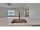 Bright kitchen featuring a stunning quartz-topped sink area with stainless steel appliances at 916 48Th Street E Dr, Bradenton, FL 34208