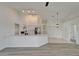 Bright kitchen with island, white cabinets, and stainless steel appliances at 916 48Th Street E Dr, Bradenton, FL 34208