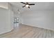 Spacious living room with ceiling fan, wood-look floors, and glass doors to the outdoor area at 916 48Th Street E Dr, Bradenton, FL 34208