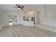 Open living space featuring wood-look floors and an island with seating at 916 48Th Street E Dr, Bradenton, FL 34208