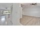 View into the living room with hardwood floors and access to the kitchen at 916 48Th Street E Dr, Bradenton, FL 34208