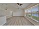 Bright living room featuring a vaulted ceiling, a ceiling fan, and a view of the water at 916 48Th Street E Dr, Bradenton, FL 34208