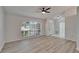 Living room featuring hardwood floors and a large window overlooking the front yard at 916 48Th Street E Dr, Bradenton, FL 34208