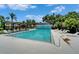 Community pool with lounge chairs, providing a relaxing and refreshing experience at 916 48Th Street E Dr, Bradenton, FL 34208