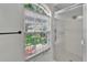 Shower with glass doors, window, and white tile at 916 48Th Street E Dr, Bradenton, FL 34208