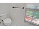 Toilet room featuring a window providing natural light and a modern towel bar at 916 48Th Street E Dr, Bradenton, FL 34208