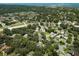 Aerial view showcases the neighborhood surrounding 945 Hamilton Court, Palm Harbor, with lush trees and scenic views at 945 Hamilton Ct, Palm Harbor, FL 34683