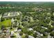 An aerial view of a residential community with mature trees and green spaces at 945 Hamilton Court, Palm Harbor, FL 34683 at 945 Hamilton Ct, Palm Harbor, FL 34683